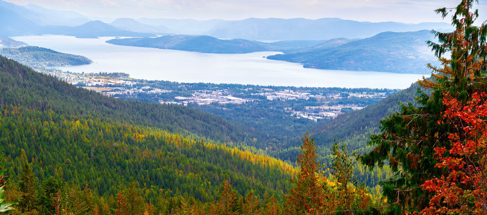 Panoramic wide angle Autumn view from Schweitzer Mountain and resort of the towns of Kootenai, Ponderay and Sandpoint, Idaho, along the shores of Lake Pend Oreille